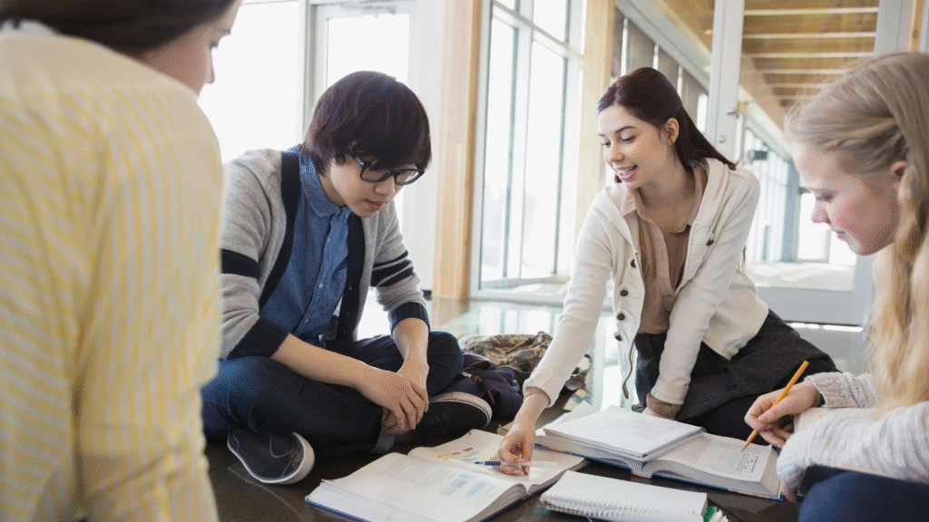 A group of students discussing savings strategies


